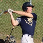 Justin Bosland finishing his swing at the plate